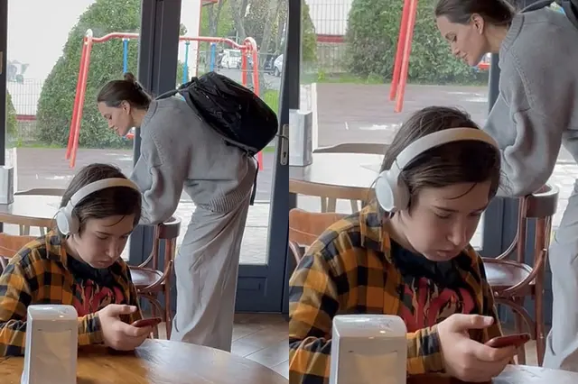 Guy in headphones with Angelina Jolie in the background blank meme template