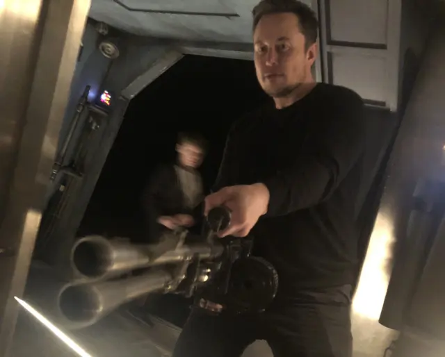 Elon Musk with a flamethrower blank meme template