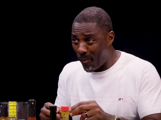 Idris Elba eats chicken wings blank meme template