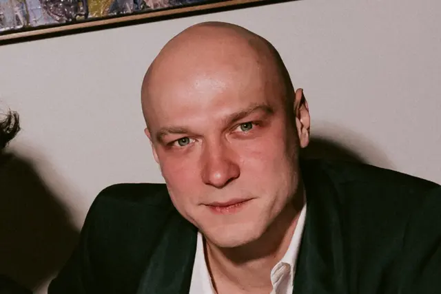 Yura Borisov at the table blank meme template